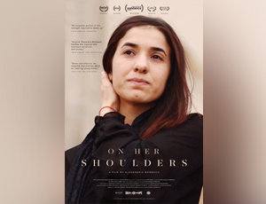 ON HER SHOULDER