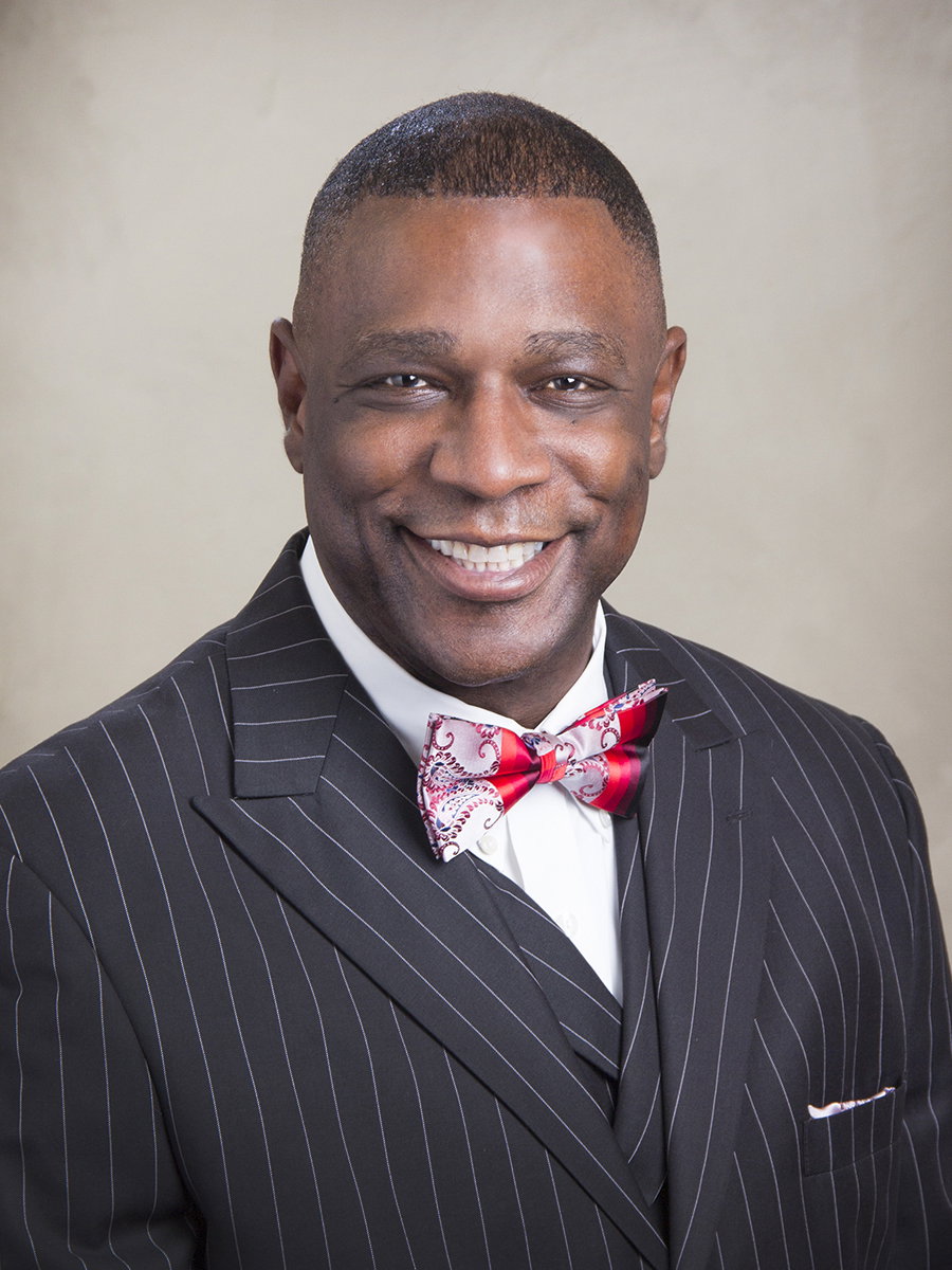 Dr. Johné Battle